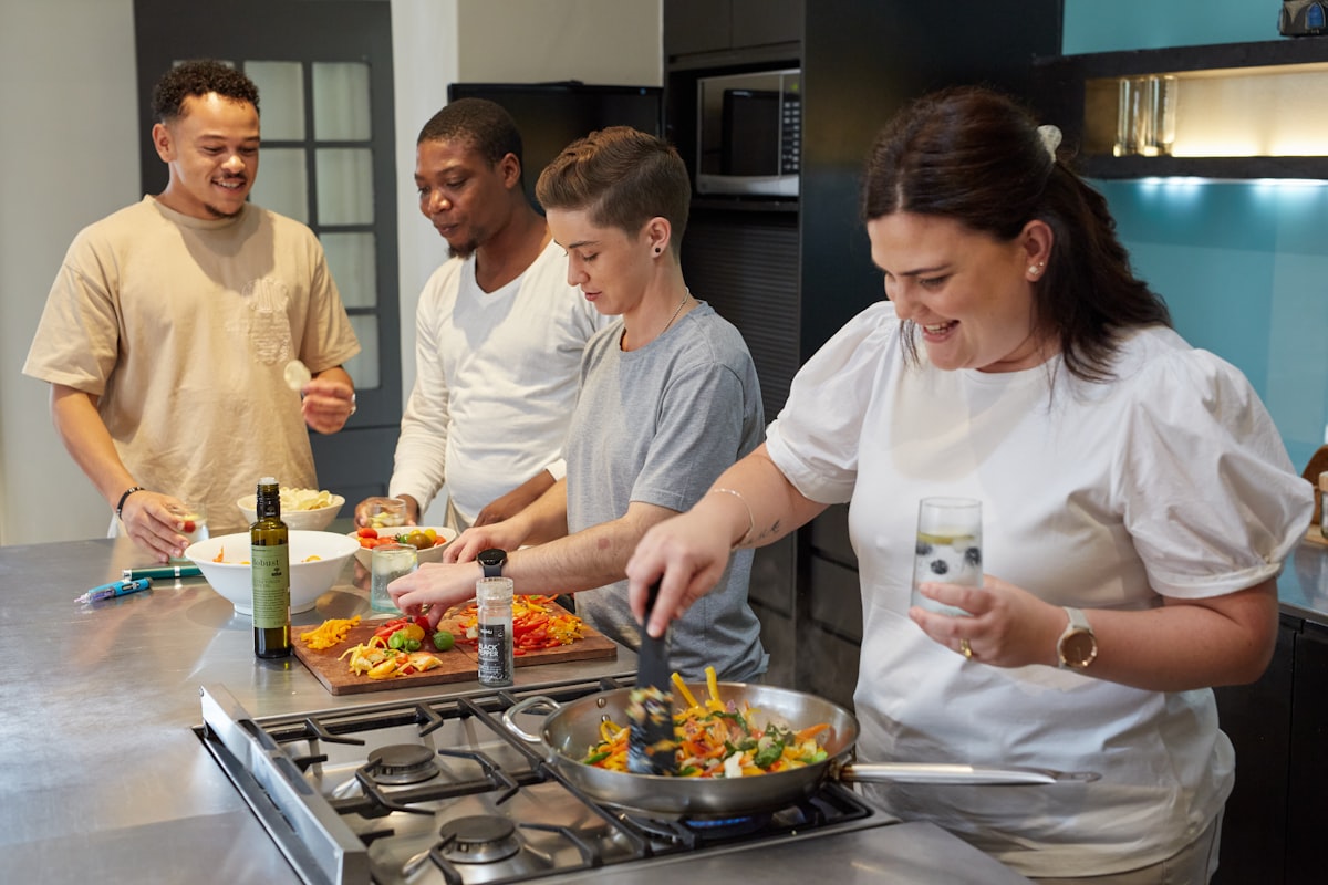 Instructor teaching healthy cooking techniques in an organic kitchen studio